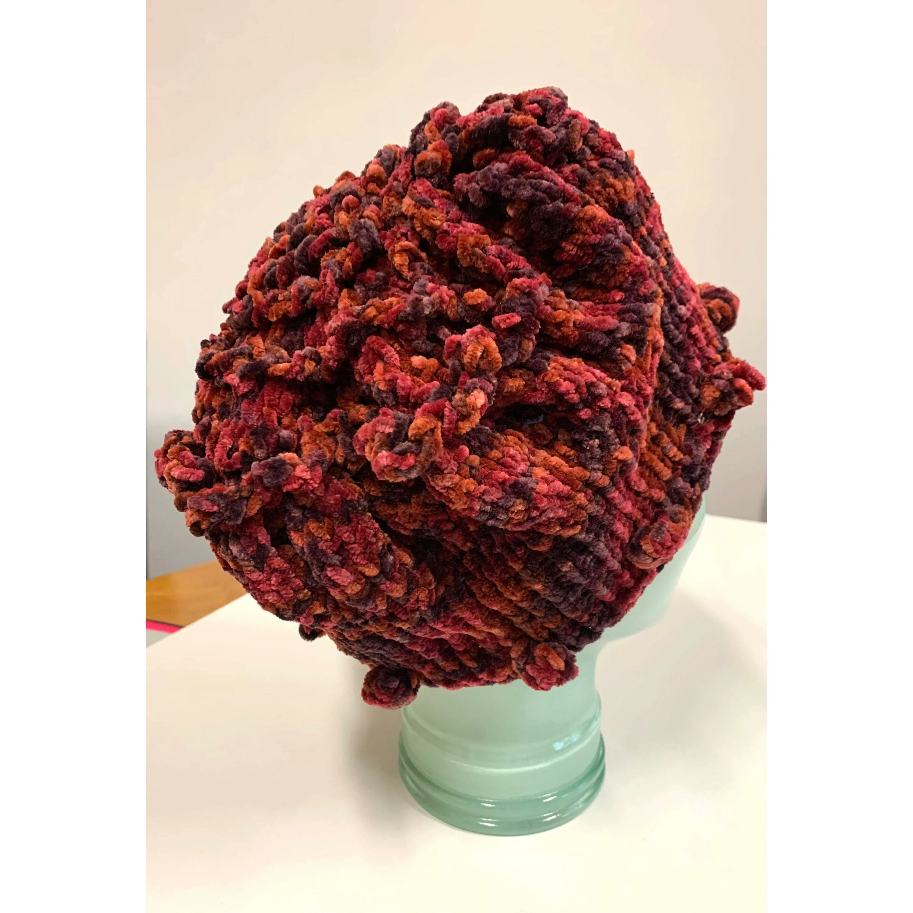 Hand knit soft bulky textural cotton chenille hat in burnt red color with popcorns.