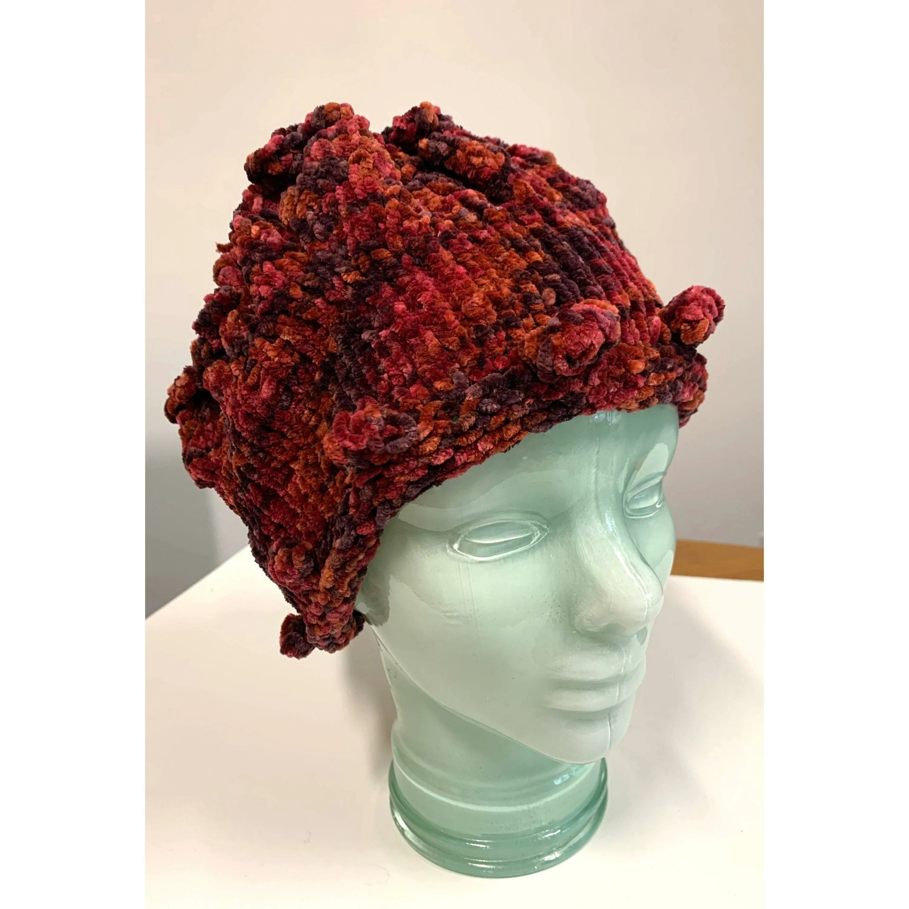 Hand knit soft bulky textural cotton chenille hat in burnt red color with popcorns.