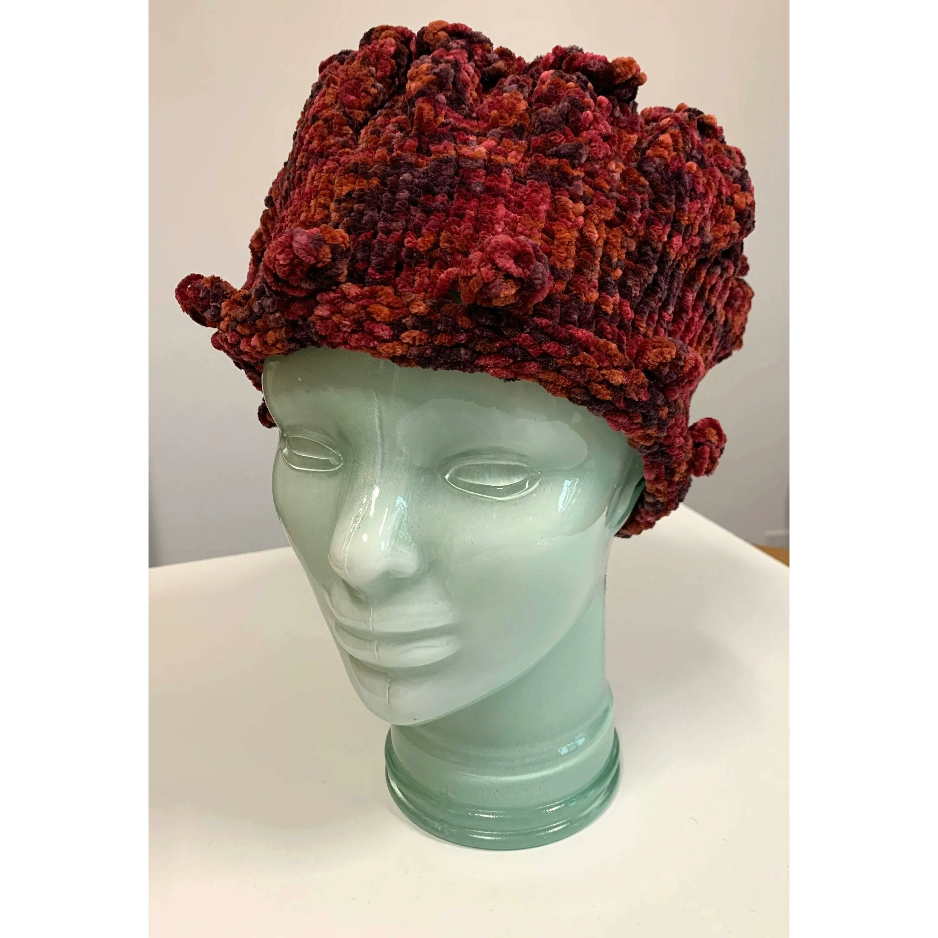 Hand knit soft bulky textural cotton chenille hat in burnt red color with popcorns.