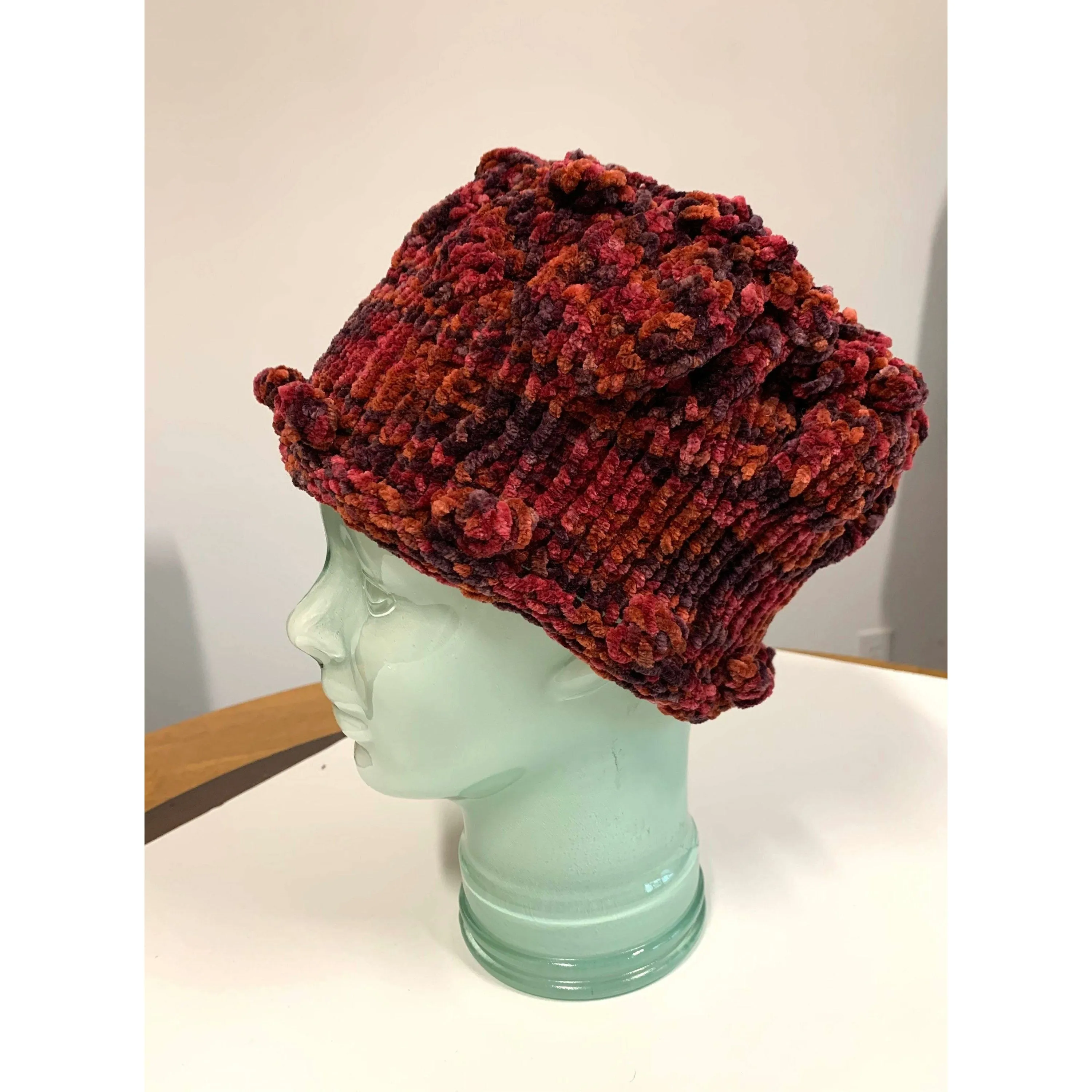 Hand knit soft bulky textural cotton chenille hat in burnt red color with popcorns.